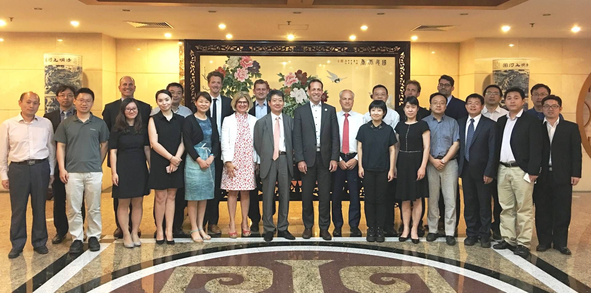 Group photo of participants with Thorsten Herdan, BMWi Director General and Liang Zhipeng, NEA Deputy Director General 